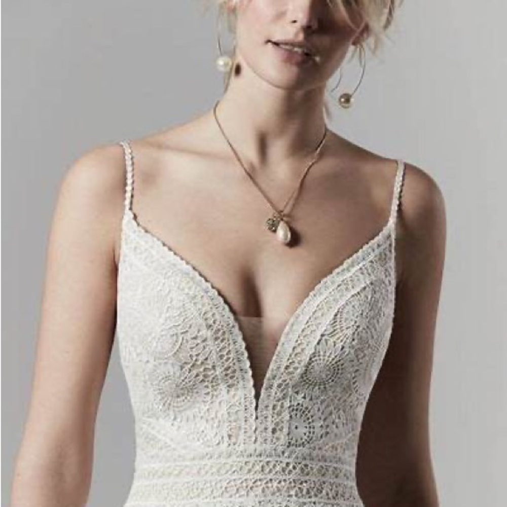 Beautiful Sottero and Midgley wedding gown. It is a ivory/ blush size 12.